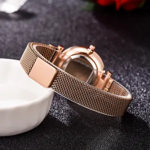 Elegant rose gold women's quartz watch with a magnetic milanese mesh band on white display
