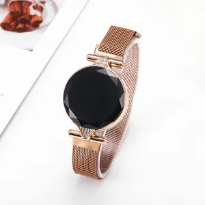 Minimalist LED digital watch with black faceted glass dial and rose gold Milanese strap