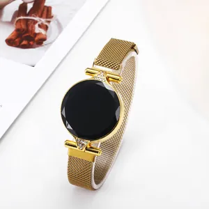 Sleek LED watch with black faceted glass dial and gold Milanese strap for women