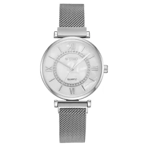Detail of silver quartz watch featuring white mother of pearl dial and rhinestone circle