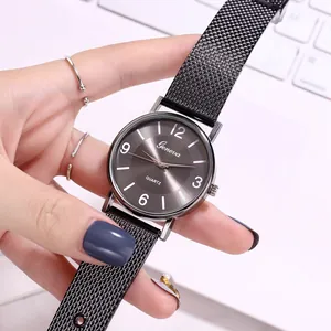 Minimalist Geneva quartz watch with dark grey dial and black mesh stainless steel strap