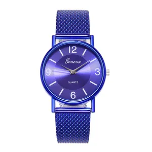 Detail of blue Geneva quartz watch featuring Milanese mesh strap and sunray dial texture