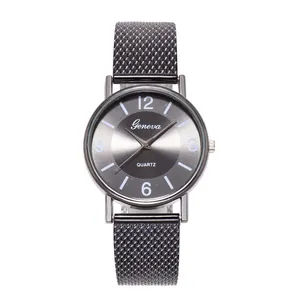 Close-up of Geneva quartz watch with dark grey sunray dial and mesh metal strap