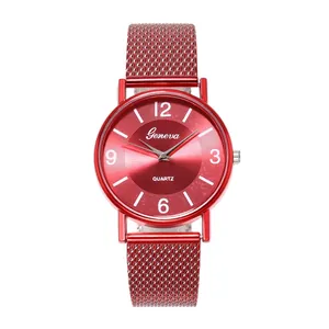 Detailed view of red quartz watch with sunray dial and mesh strap by Geneva