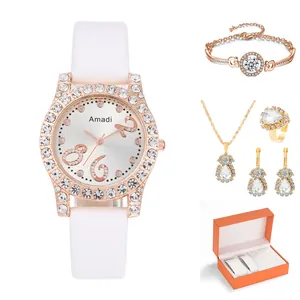 Dettaglio del set orologio da donna e gioielli con pendenti a goccia in confezione