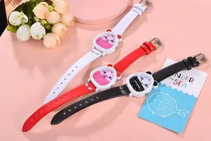 Detail of cute quartz watches with bear-shaped cases and colorful straps for girls