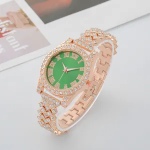 Elegant rose gold women's watch with green Roman numeral dial and rhinestone strap