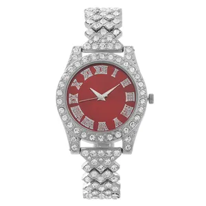 Macro shot of luxury women's watch with red dial, Roman numerals and rhinestone strap
