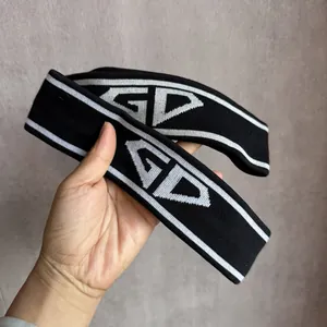 Elastic knitted sports headband in black and white with GD pattern for running and yoga