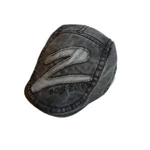 Vintage washed charcoal denim flat cap with Z patch and Boston embroidery on white background