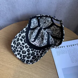Vintage leopard print baseball cap with adjustable metal buckle and interior details