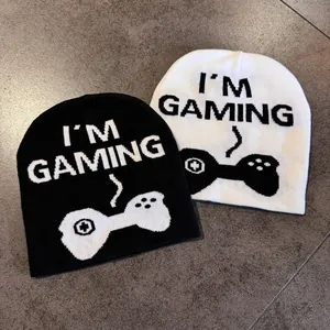 Detailed view of knitted jacquard patterns and 'I'M GAMING' text on beanies
