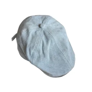 Light blue denim ivy cap with fine twill texture shown from a top-down angle view