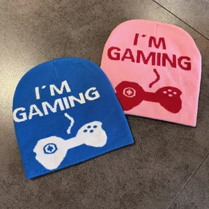 Detail of jacquard knit beanies with I'M GAMING text and gamepad pattern icons