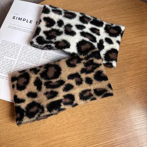Cozy leopard print plush headbands set in brown and grey faux fur for winter warmth