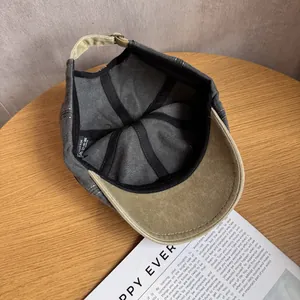 Retro washed cotton newsboy cap in charcoal and khaki with adjustable metal buckle