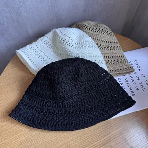 Three colors of hollow knit bucket hats in black, beige and khaki for summer sun protection