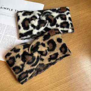 Detail of leopard print knitted headbands with knot design and NY leather tags