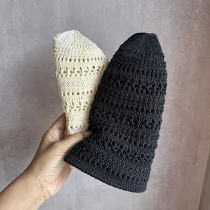 Detailed close-up of hollow knit bucket hat showing intricate crochet mesh patterns