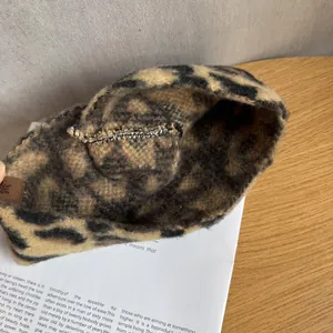 Vintage leopard print bucket hat showing interior stitching and soft plush texture