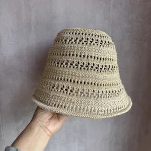 Close-up of beige breathable hollow knit sun hat showing detailed handwoven texture