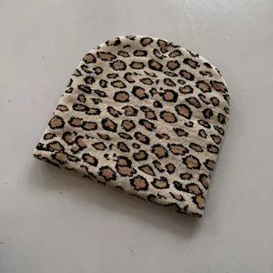 Close-up of leopard jacquard knit pattern on a khaki streetwear beanie hat
