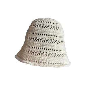 Breathable cream hollow crochet bucket hat with elegant woven knit texture for summer sun protection