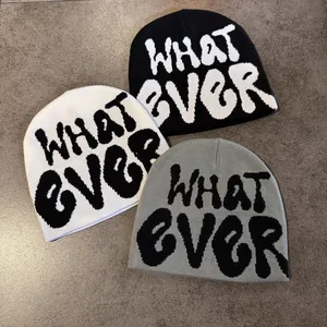Three knit beanies in black white and gray with stylish WHATEVER lettering design