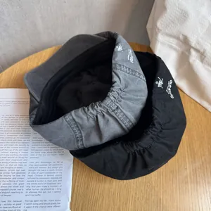 Japanese style minimalist cotton newsboy caps in black and grey with logo embroidery