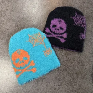 Fuzzy knit beanies with skull and spider web jacquard in black and blue colors