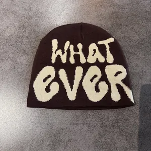 Detail shot of the whatever graffiti jacquard knit on the warm winter beanie