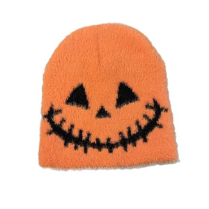 Fuzzy orange pumpkin beanie with black Jack-o'-lantern face for Halloween costumes