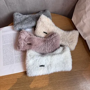 Plush winter knit headbands in four colors featuring elegant metal logo branding