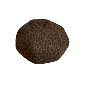 Vintage leopard print beret made of wool blend fabric shown on a white background