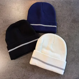 Knitted roll-up beanies in navy, black and beige with reflective safety strips