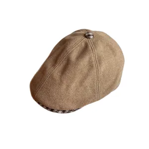 Brown plaid newsboy cap for women in vintage British style with textured wool fabric