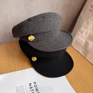 British wool baker boy hats in black and dark grey with decorative gold metal buttons