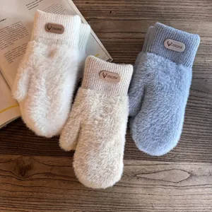 Thick plush winter mittens for women featuring ribbed knit cuffs and warm fleece lining