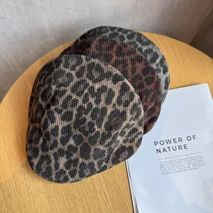 Detailed knit texture of vintage leopard print ivy caps in three stylish color variations