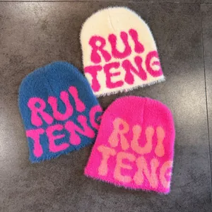 Faux mink fur knit beanies with RUI TENG lettering in ivory, royal blue, and pink