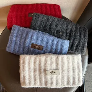 Knitted wide headbands in red, grey, blue, and beige with stylish leather patch detail