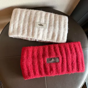 Winter knitted headband set in red and beige with warm ribbed texture and leather patch