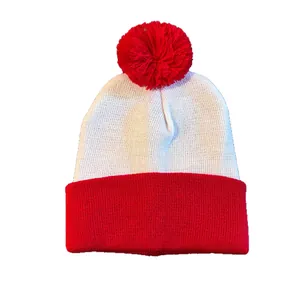 Red and white knit beanie with a pom-pom top and cuffed brim for winter warmth