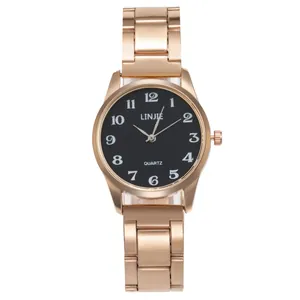 Montre à quartz pour femme en or rose avec cadran noir élégant et bracelet métal