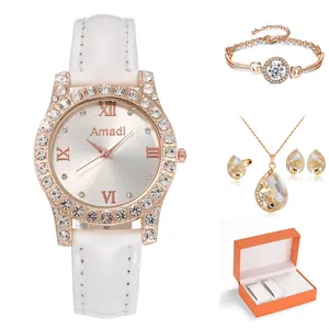 Coffret luxe montre femme or rose et bijoux sertis de diamants avec boîte orange