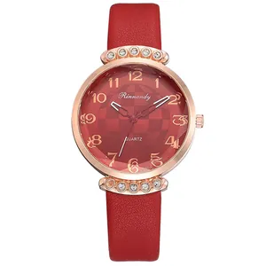 Detail showing the red leather strap texture and rose gold diamond-encrusted watch case