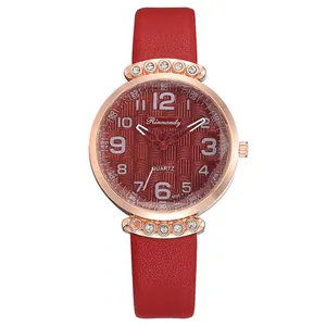 Close-up of women fashion quartz watch with red leather strap and sparkling crystal case
