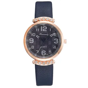 Detail of rose gold watch case with crystal rhinestones and textured navy blue dial