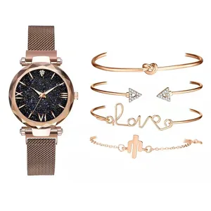 Detail view of five-piece rose gold watch set with star dial and matching bracelets