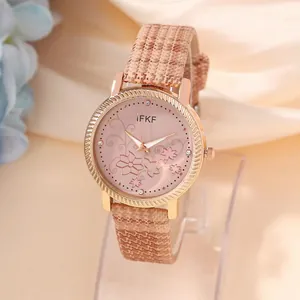 Elegant women's quartz watch featuring a rose gold case and floral dial on pink strap